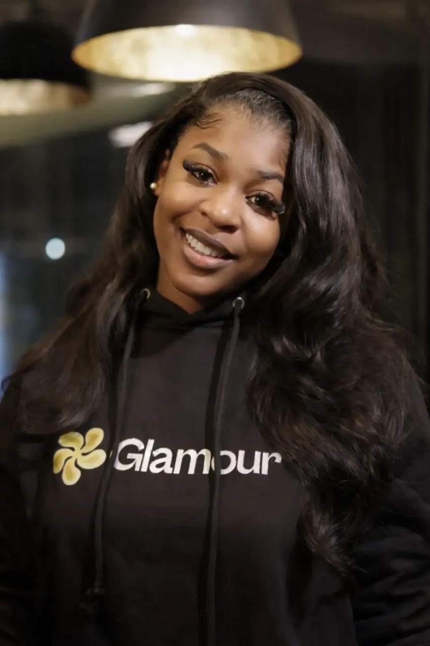 Glamour member wearing branded hoodie