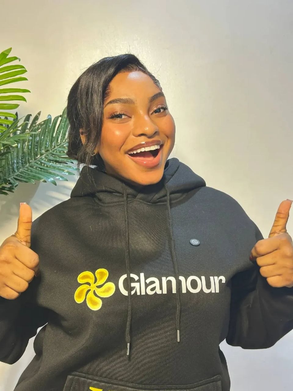 Glamour member giving thumbs up